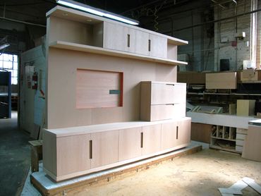 A wooden display with multiple cabinets