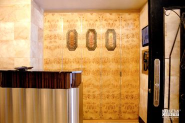 Item: CTC044 - Mappa Burl, Maple Traditional style closet doors in building lobby. IINTERIOR RESTORA
