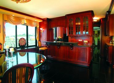 Item: KTC009 – Cherry Traditional style with raised panels and granite top.