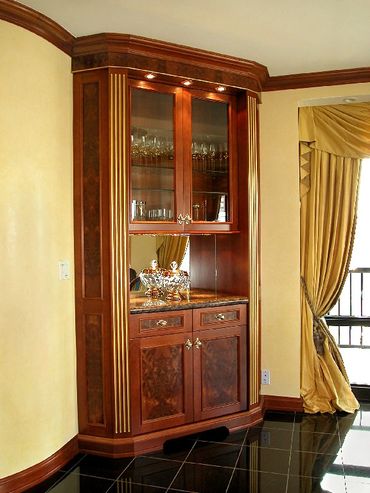 Traditional corner bar with stone top and gold gilt accen