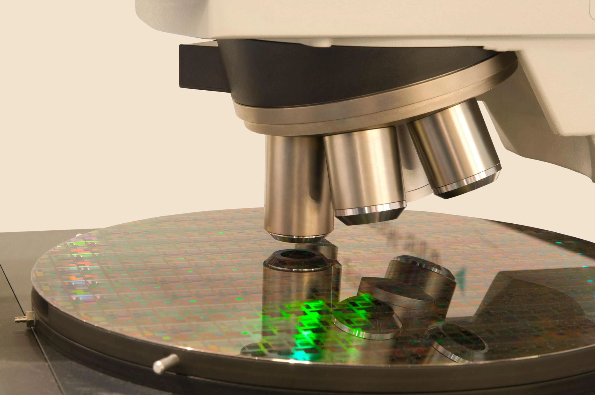 Microscope examining a silicon wafer with microchips.