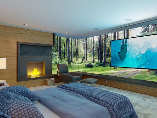 Modern bedroom with forest view and projector screen.