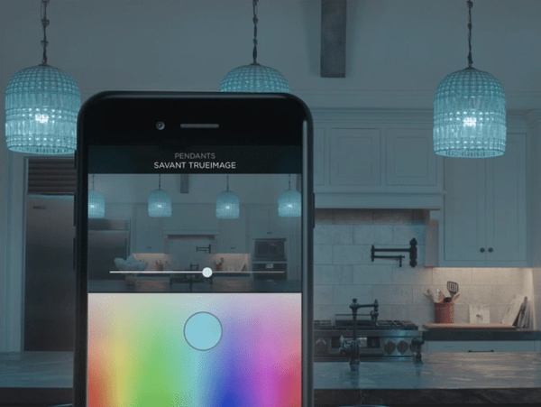 Smartphone controlling kitchen pendant lights' colors.