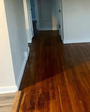 Damaged floor cleaned, and polished with wood oil