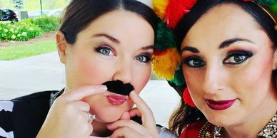 Mirah and Emily before an eskandarani performance Emily wears a mustache to portray a male character