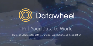 Datawheel text and yellow circle logo overlaid onto dark blue and grey waves of information