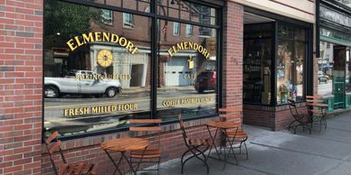 Elmendorf Baking Supplies windows and cafe tables on Cambridge Street
