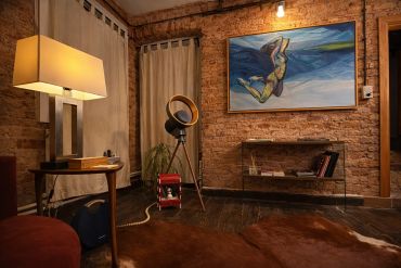 Cozy room with exposed brick walls and warm lighting.