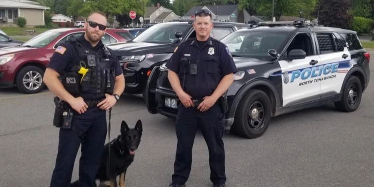 Photo of Officers Kam and Smith with K9 Stella at OHIO school.