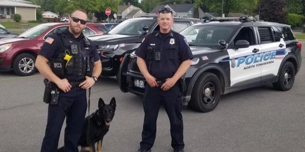 Photo of Officers Kam and Smith with K9 Stella at OHIO school.