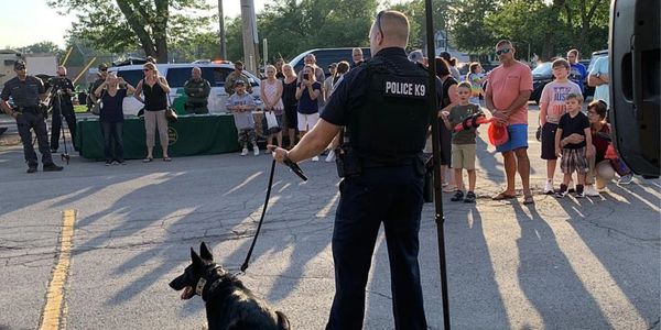 Photo of Officer Kam with K9 Stella at National Night Out 