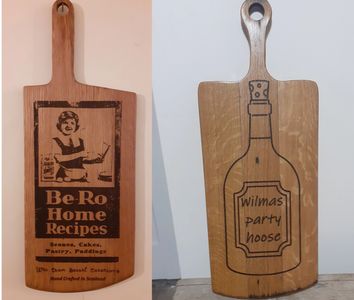 a pair off oak charcuterie/cheesboards made from whisky barrel tops. By wee dram barrel creations