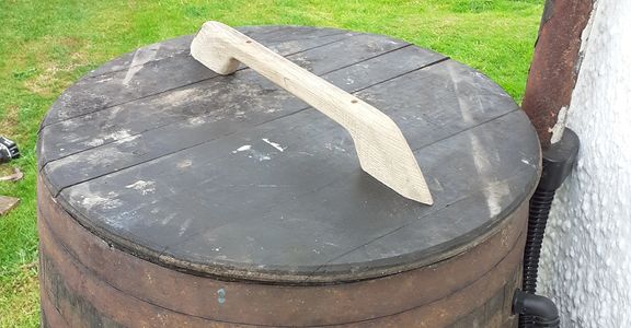 a sherry cask whisky barrel used as a water butt with a oak handled top by wee dram barrel creations
