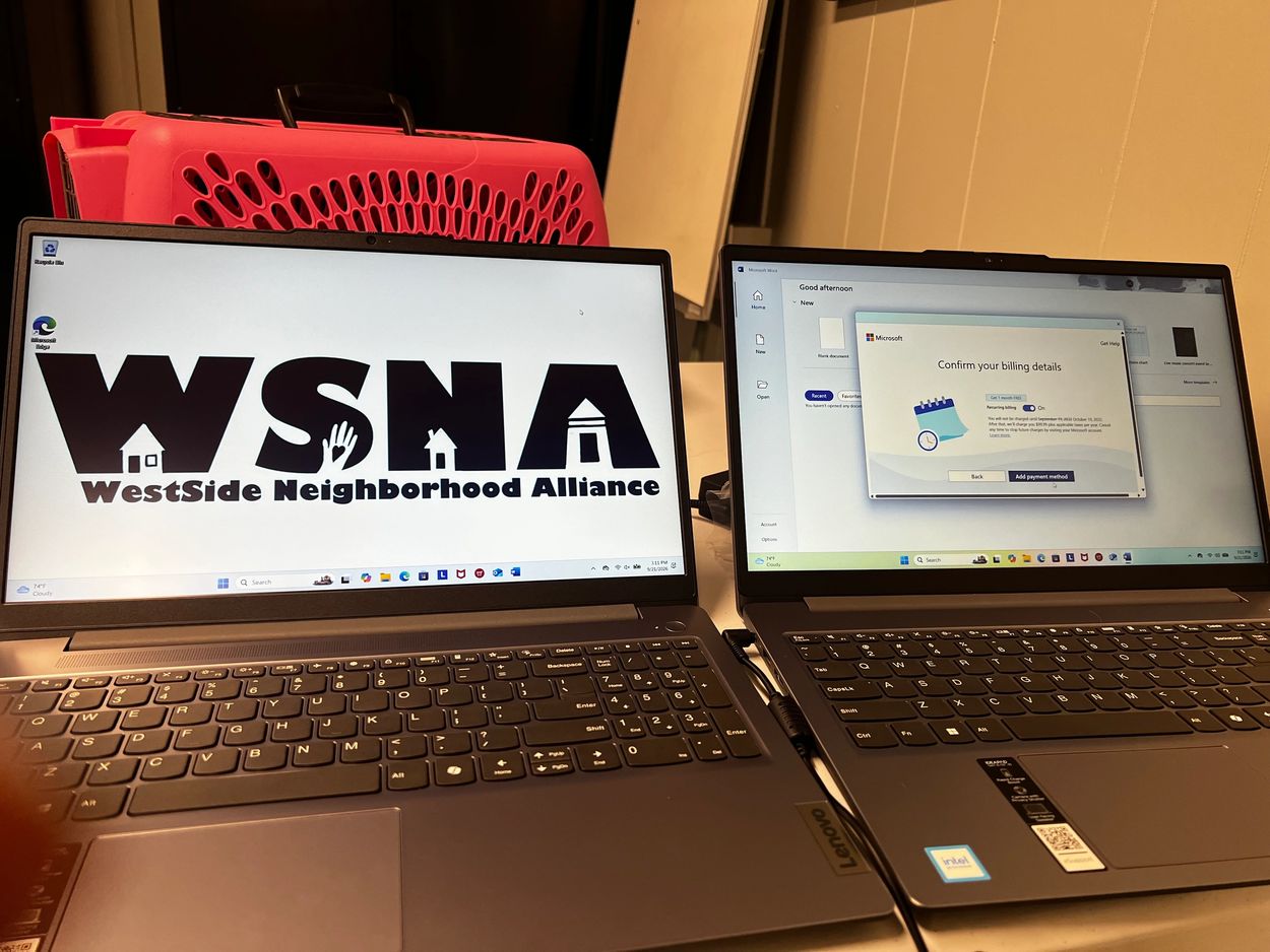 Two Lenovo laptops side by side on a desk.
