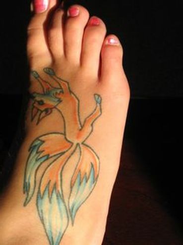 Photograph by artist Mina Koury Martin of college co-ed with three tailed fox tatoo on right foot