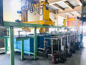 Industrial water filtration system with pipes and tanks in a factory setting.