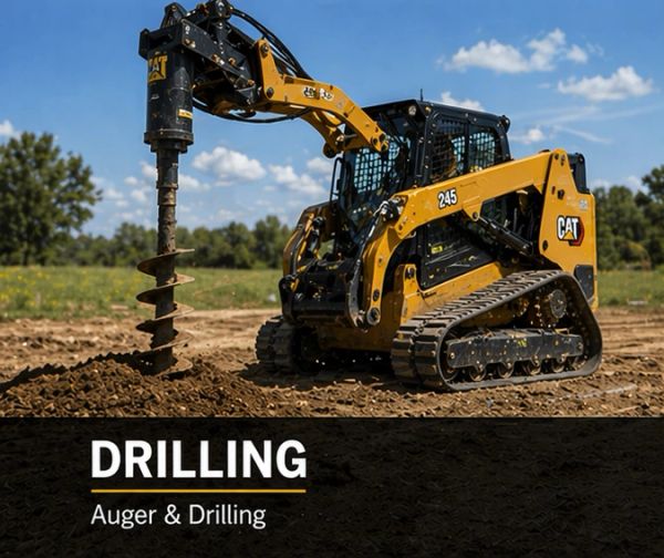 A CAT 245 drilling machine with an auger attachment working on soil.