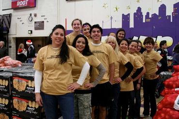 Community members looking in a queue.
