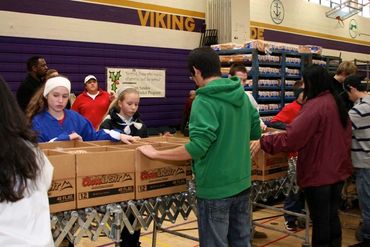 Group of volunteers cheering together.