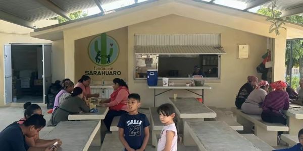 Children and adults gathered at Fundación Sarahuaro community center.