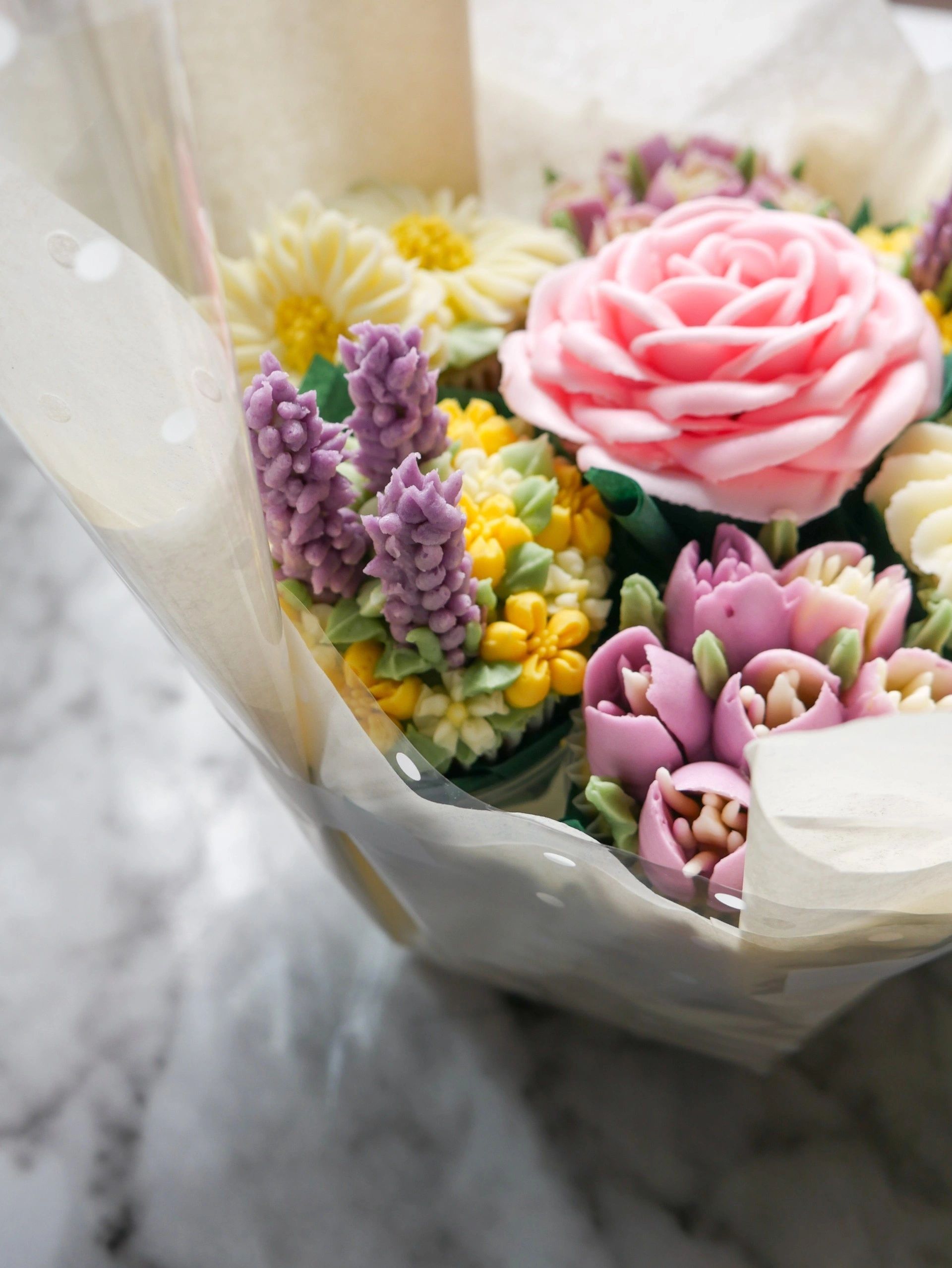Close-up of a bouquet with pastel-colored flowers.