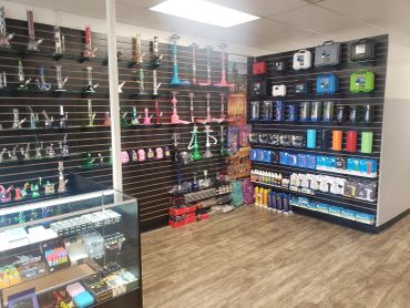 Wall of colorful glass hand pipes and bongs for sale