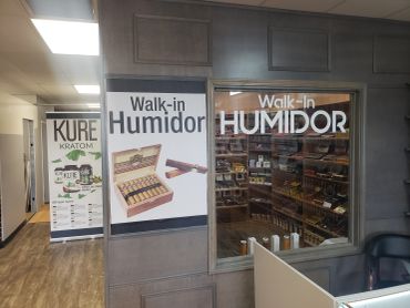 Walk-in humidor entrance at Lit Tobacco, a cigar and tobacco shop in Waterford, MI