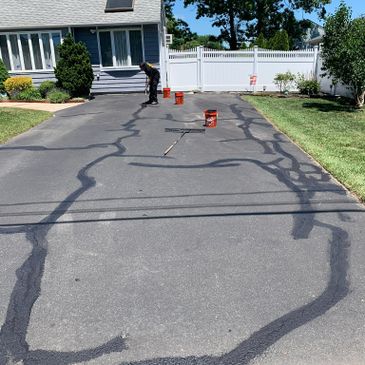 Crackfilling along with sealcoating can extend the life of your asphalt driveway ..we have a full li