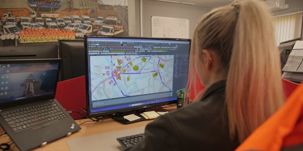 staff at computer planning  - Highway Assurance Ltd