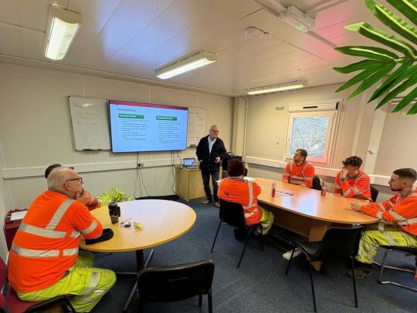 staff in meeting room  - Highway Assurance Ltd
