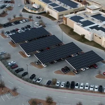 Solar panels cover parking areas, providing shade and renewable energy.