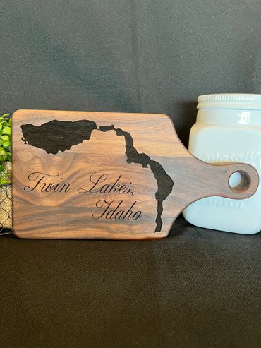 Walnut cutting board with twin lakes Idaho on it