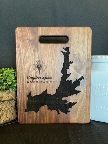Walnut cutting board with Hayden lake and a compass