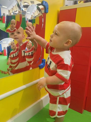 Toddler playing with sensory toy at Poppets Play Place Indoor playground West Knoxville Farragut