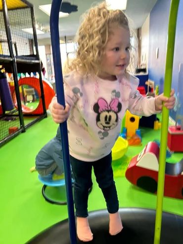 Girl jumping and playing at Poppets Play Place Indoor playground West Knoxville Farragut