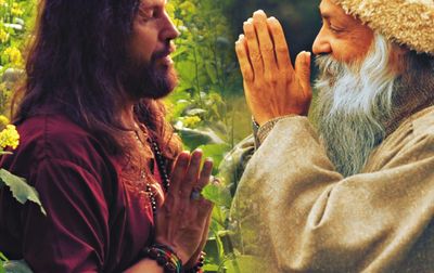 Two men meditating with hands in prayer.