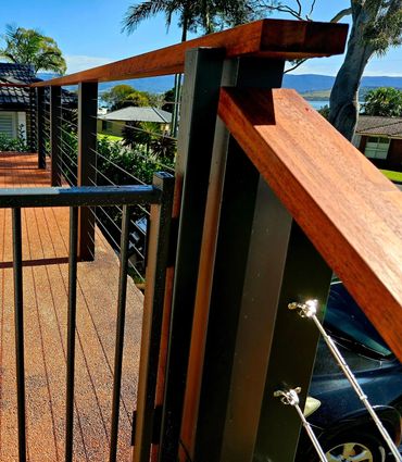 Merbau Handrail with stainless steel wire balustrade by Structural Design Carpentry
In Shellharbour