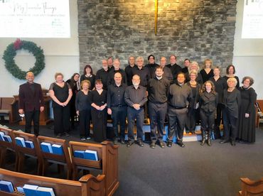 A formal group shot before a Christmas concert