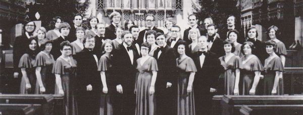 The group from the early days posing in suits and gowns