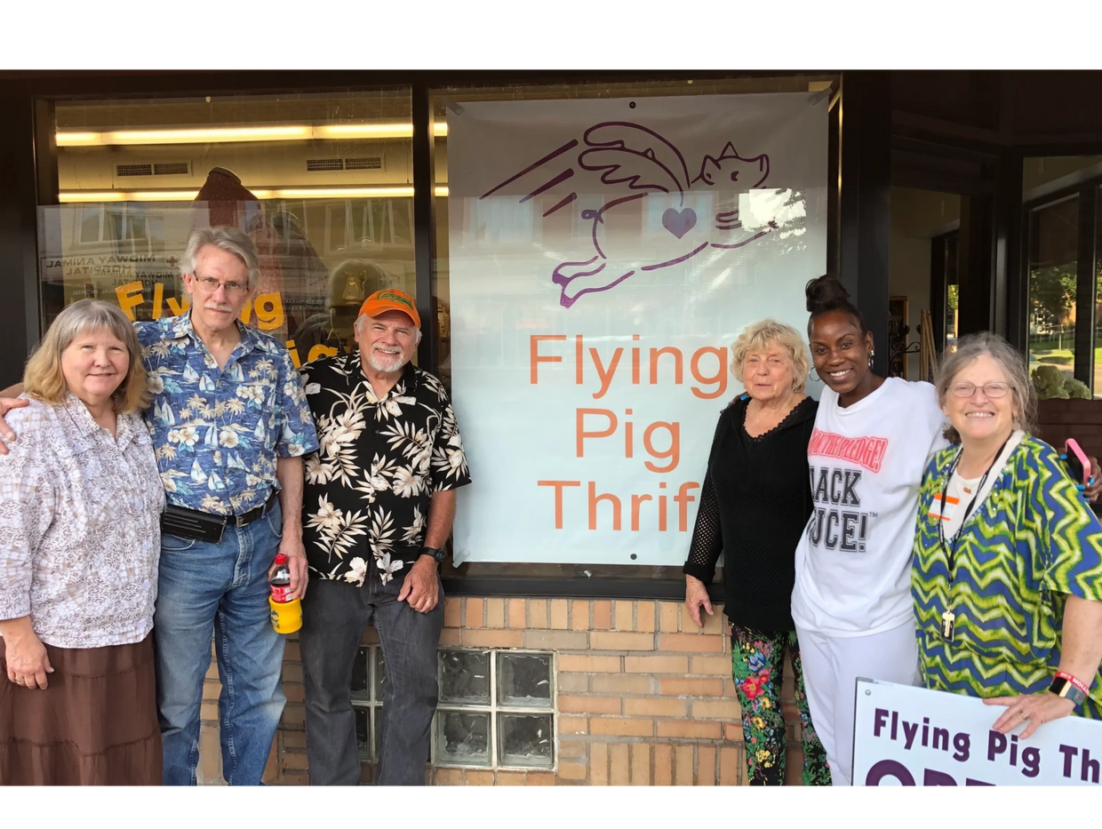 The Flying Pig Thrift board members and founders outside of the store on opening day in 2019.