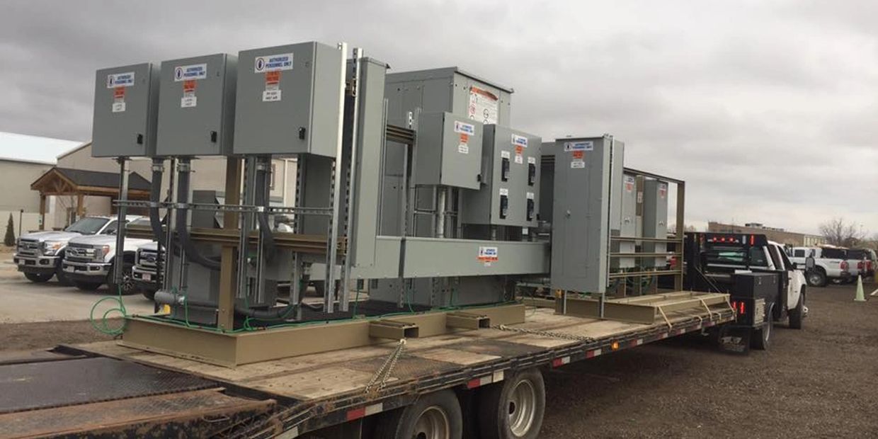 Large electrical equipment on a flatbed trailer.