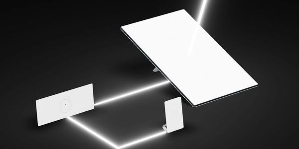 Futuristic white digital devices connected by glowing lines.