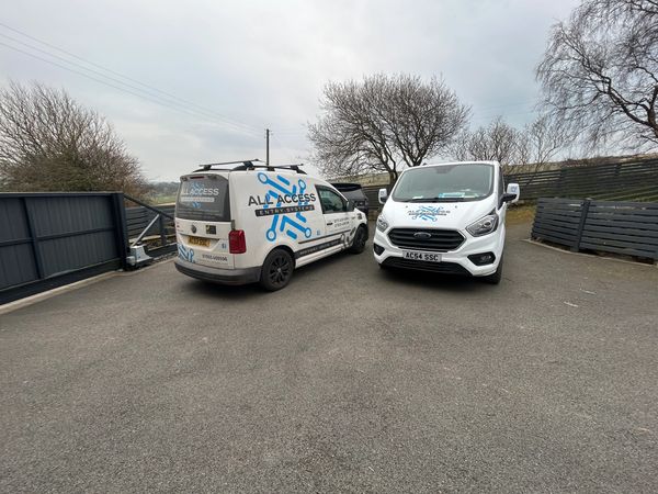All Access Entry Commercial Vans in front of Custom Made Swinging Automatic Gate in West Yorkshire
