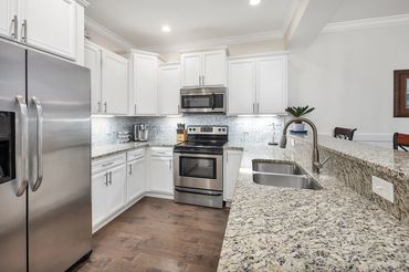 Kitchen with stainless steel appliances, granite countertops, Ninja air fryer/toaster oven, instapot