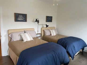 Second floor bedroom with two full size beds.