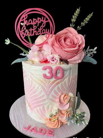 This beautiful birthday cake comes with fresh flowers on top. Add a birthday pick to your order.