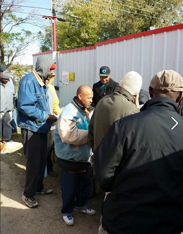 thanksgiving outreach, people line up to get food.