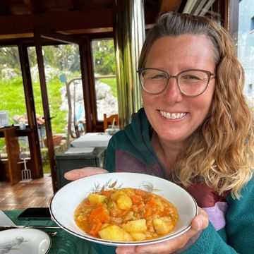 Kate enjoying her home cooked meal on the Camino del Norte, Spain.