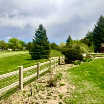 New wood rail fencing at golfcourse community
