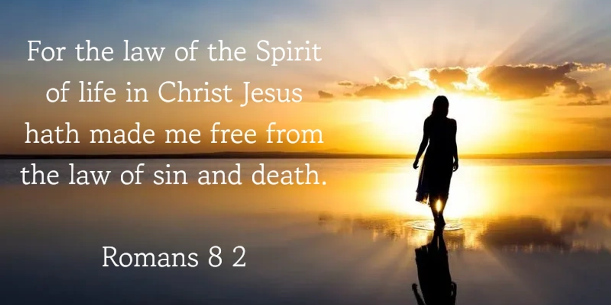 Silhouette of a person walking on water at sunset with a Bible verse about freedom in Christ.